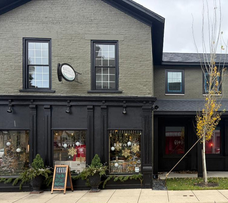 Two-story building with storefronts on a street corner